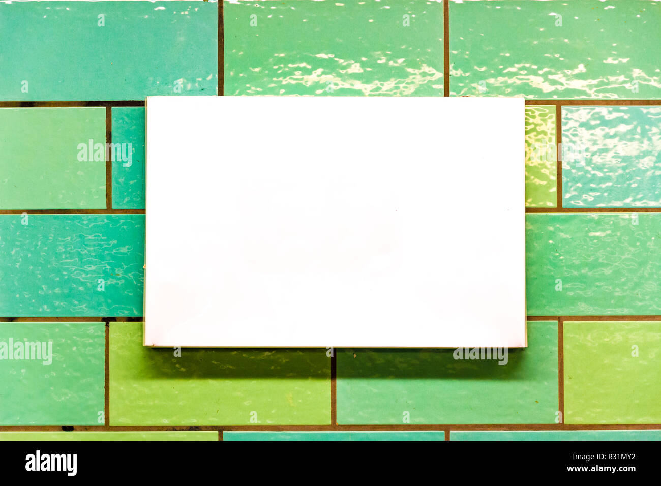 White rectangular panel with copyspace on a tiled wall Stock Photo