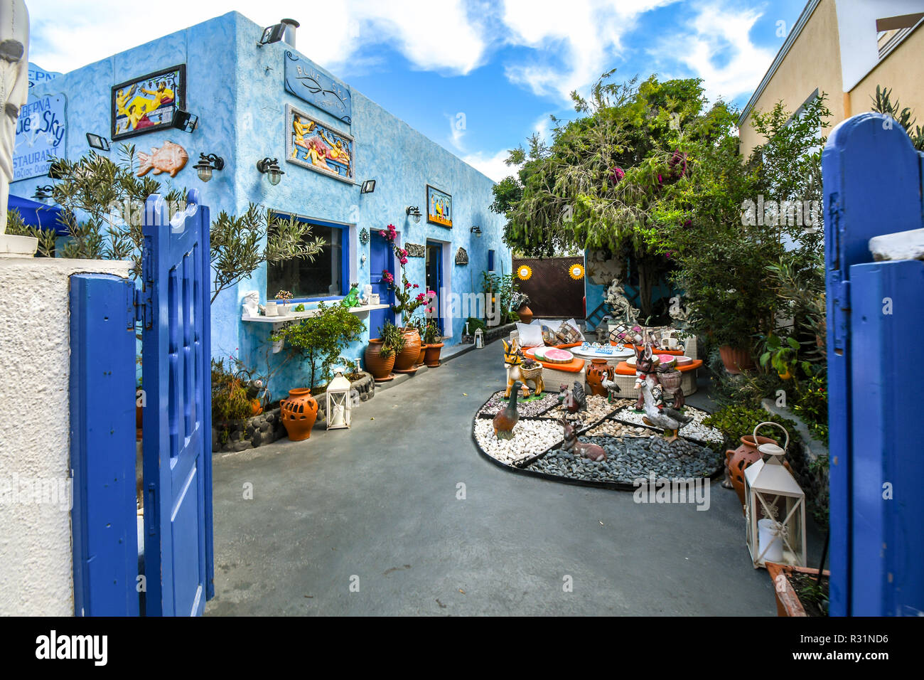 A colorful patio outside a souvenir shop and restaurant in the resort city of Thira on the island of Santorini, Greece. Stock Photo