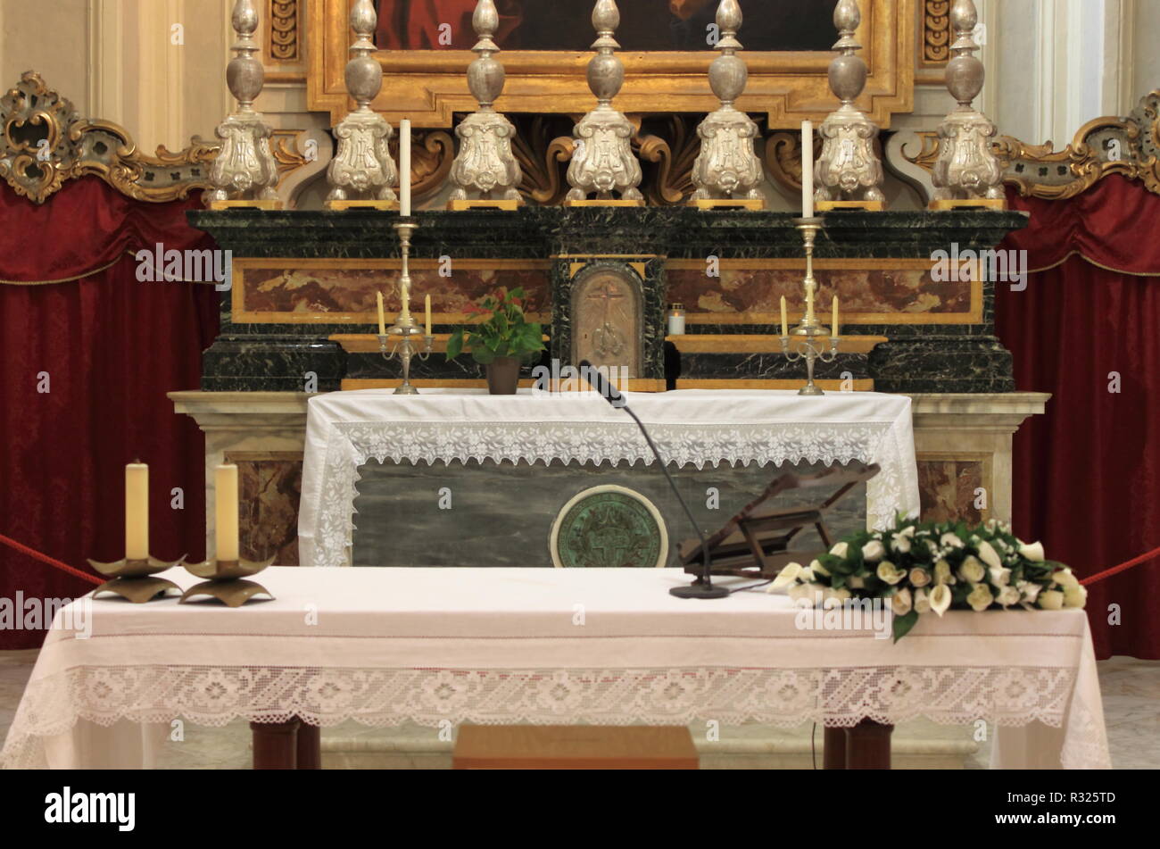 Catholic altar in a church with candles and flowers Stock Photo Alamy