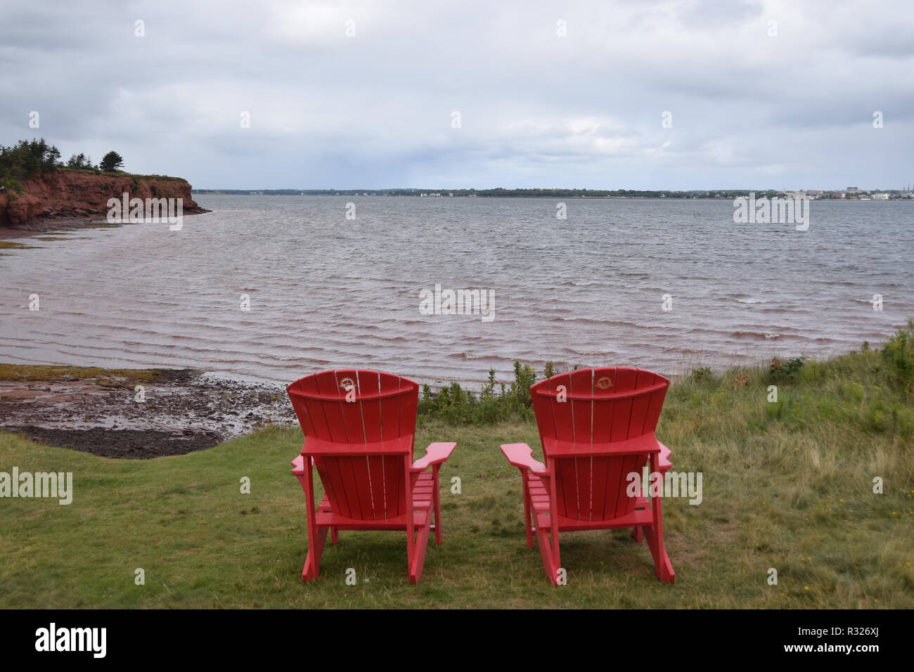 Red Adirondack Chair At Beach