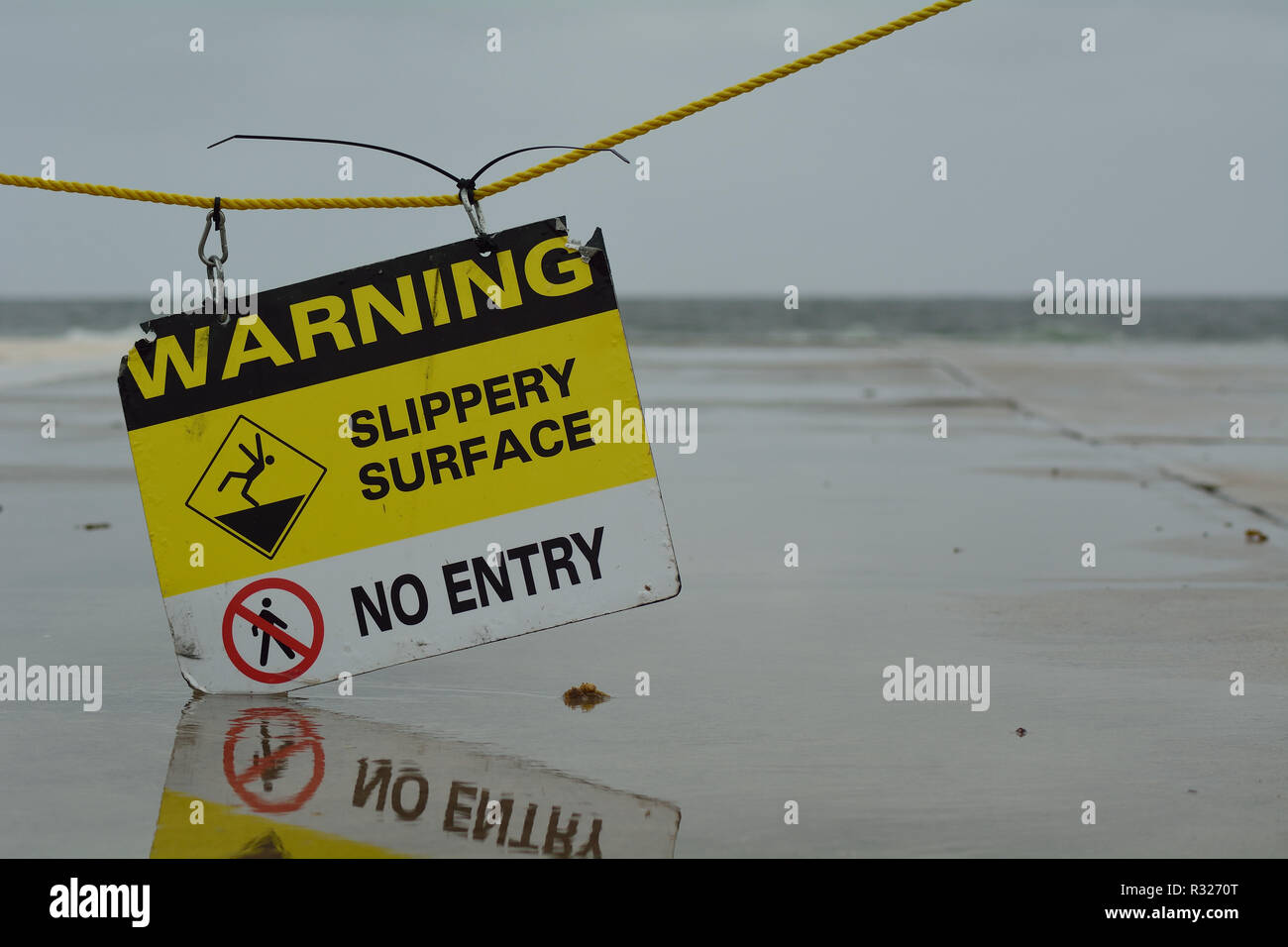 Slippery Surface Warning Sign Stock Photo