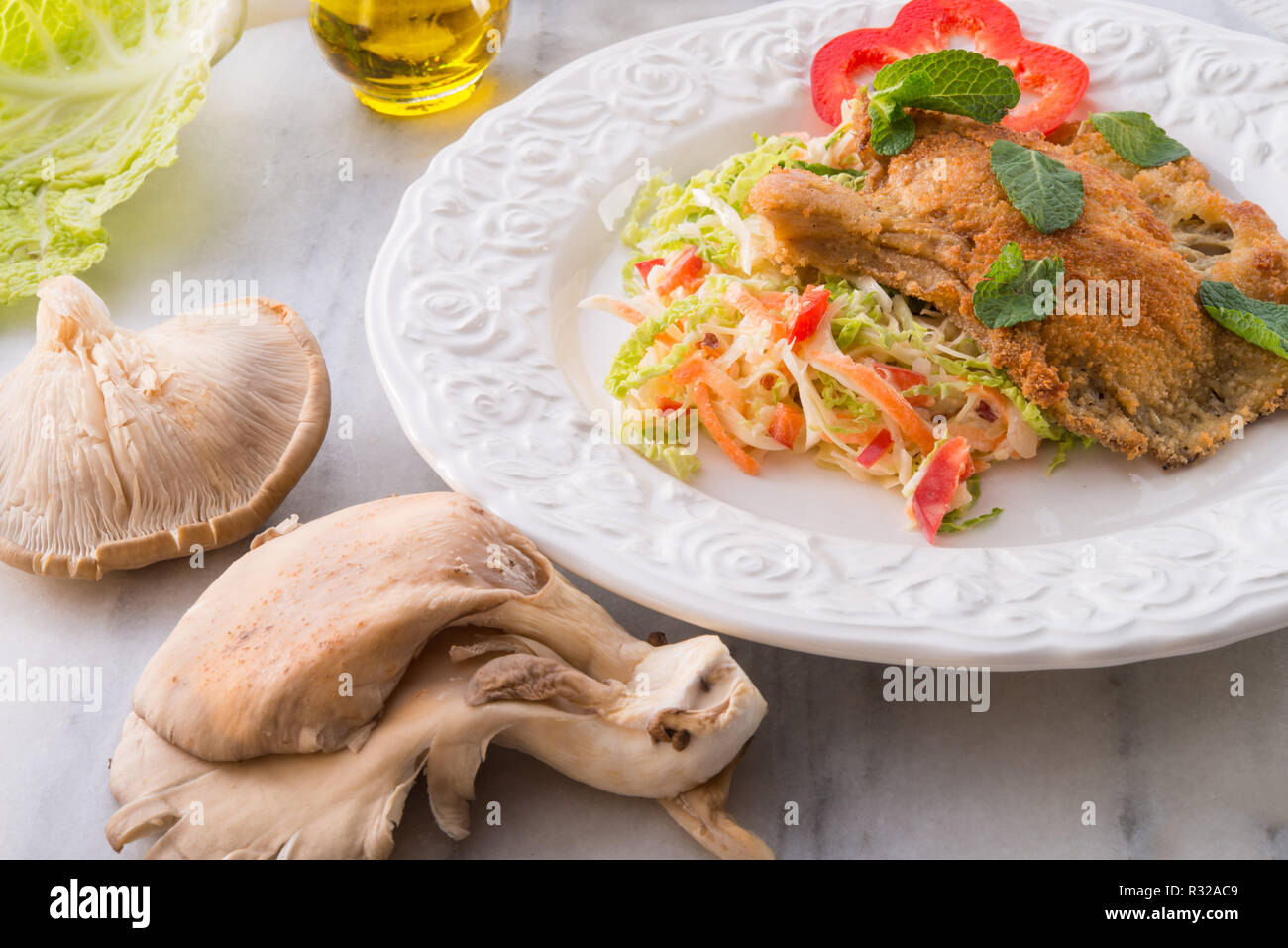 baked oyster mushrooms with fresh savoy cabbage salad Stock Photo Alamy