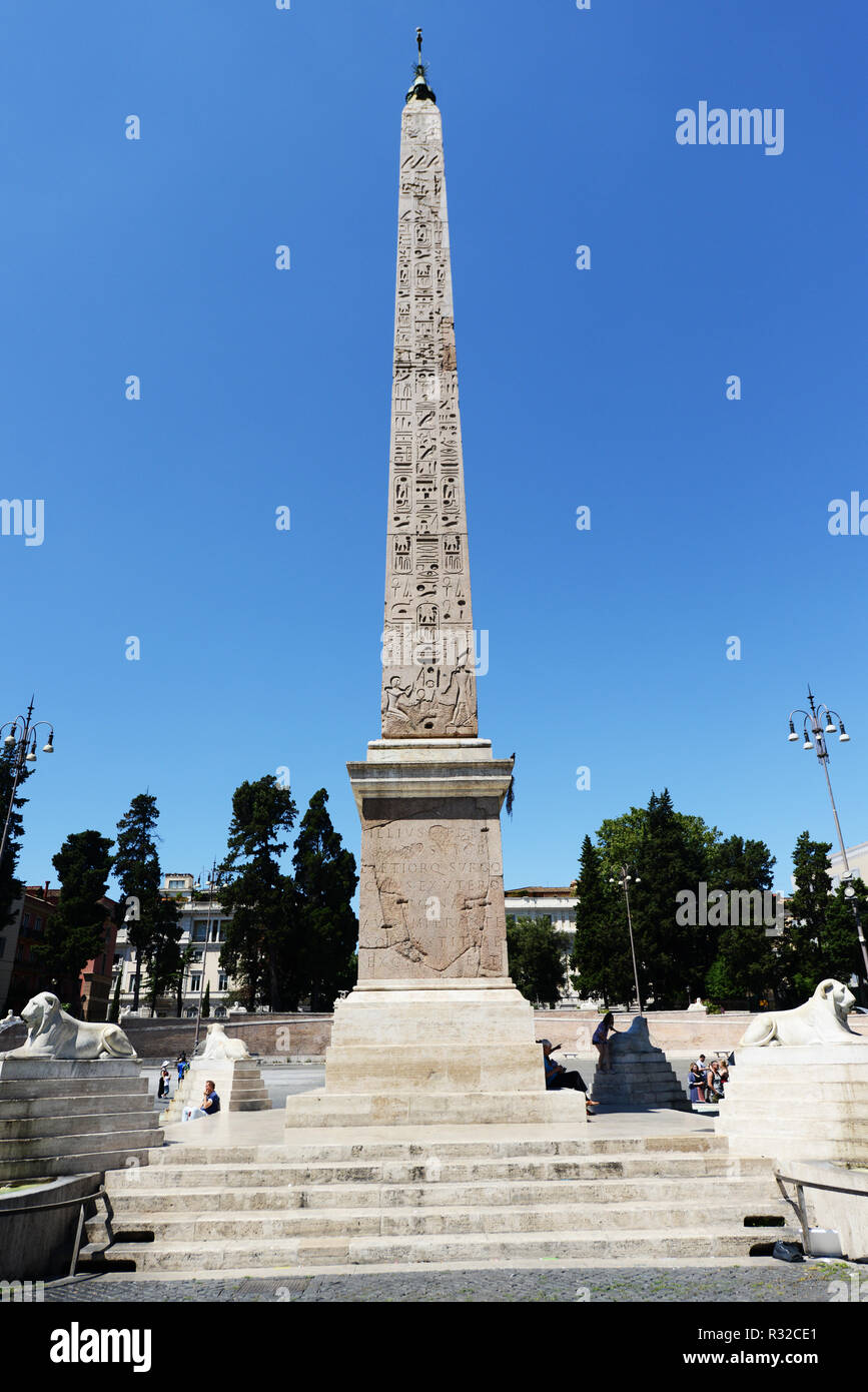 An Egyptian obelisk of Ramesses II from Heliopolis stands in the centre of the Piazza del Popolo in Rome. Stock Photo