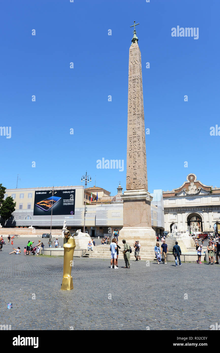 An Egyptian obelisk of Ramesses II from Heliopolis stands in the centre of the Piazza del Popolo in Rome. Stock Photo