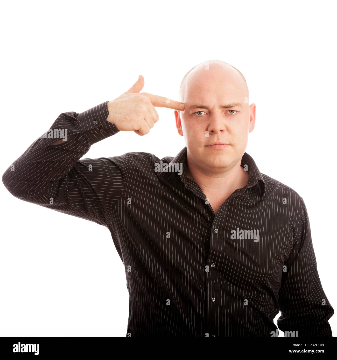 Young man pointing gun head hires stock photography and images Alamy