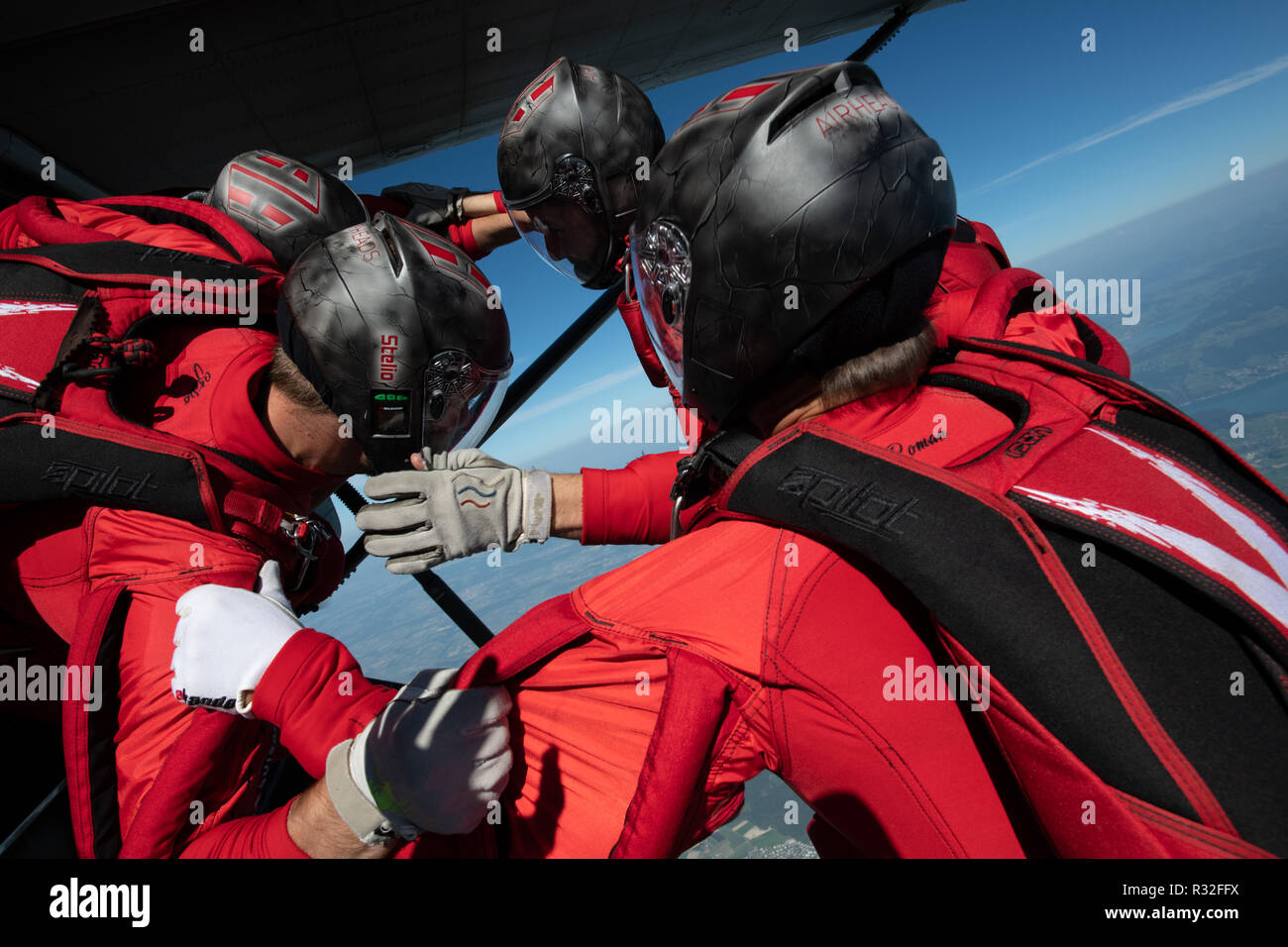 Skydiving Team just split second asplit second after leaving the airplane Stock Photo