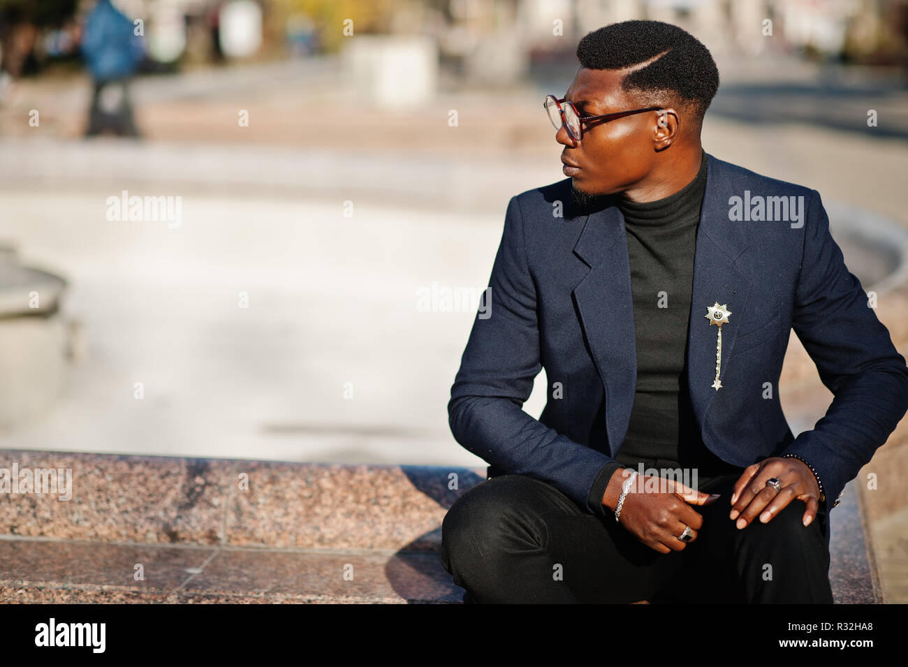 Amazingly looking african american man wear at blue blazer with brooch, black  turtleneck and glasses posed at street. Fashionable black guy Stock Photo -  Alamy
