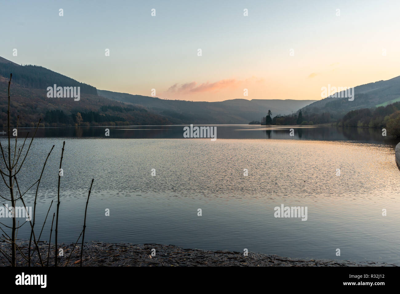 Scenic view across the Talybont Reservoir in the Brecon Beacons during sunset, Powys, Wales, UK Stock Photo