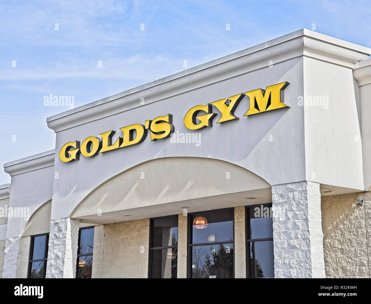 Golds Gym health club front exterior entrance sign, and corporate logo in Montgomery Alabama, USA. Stock Photo