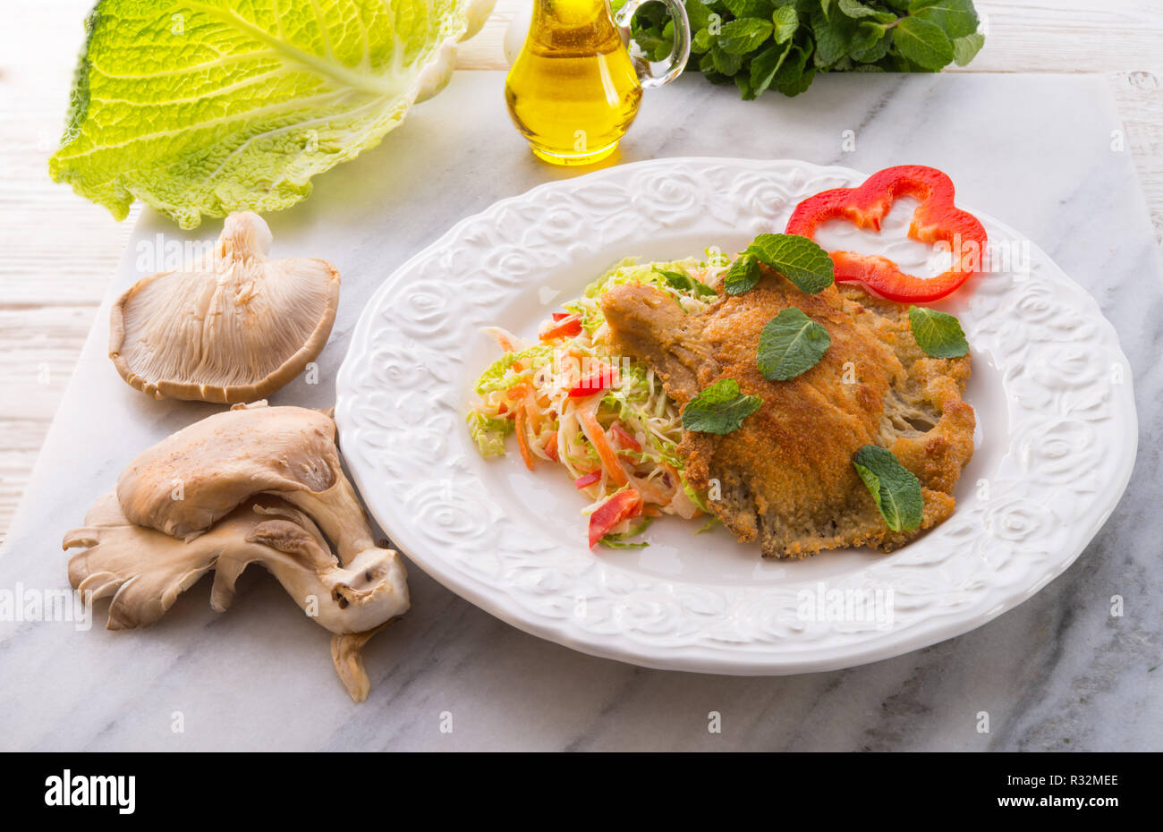 baked oyster mushrooms with fresh savoy cabbage salad Stock Photo Alamy