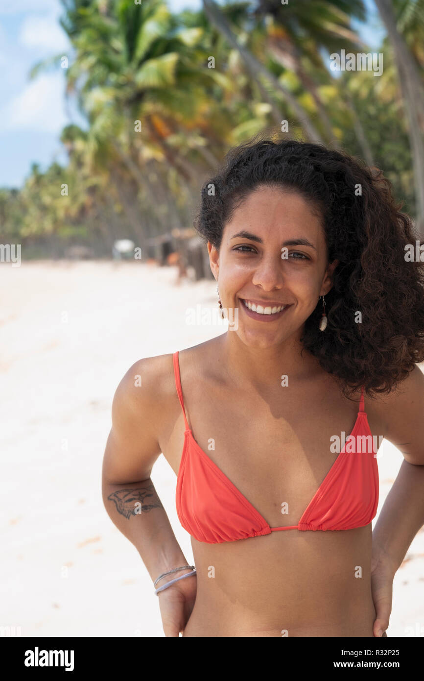 A portrait of a beautiful young Brazilian woman in a bikini on a tropical beach in Bahia Stock Photo