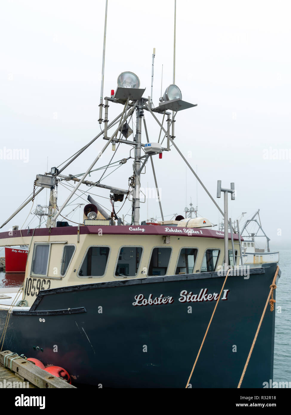 Lobster Boats Sit In A Protected Cove At Cape Forchu, Nova Scotia ...