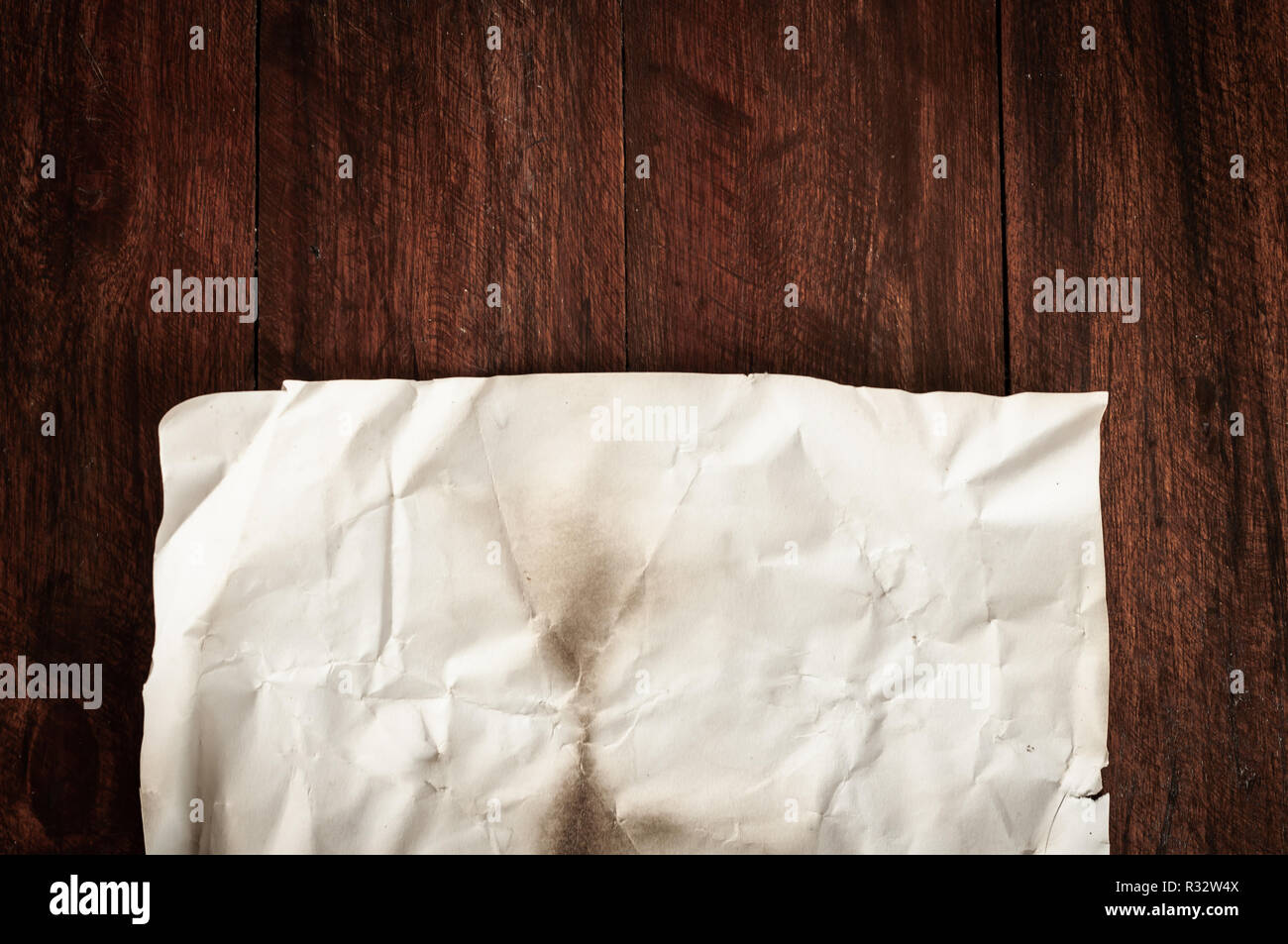 Background texture of crumpled aged paper with spot and stain Stock Photo