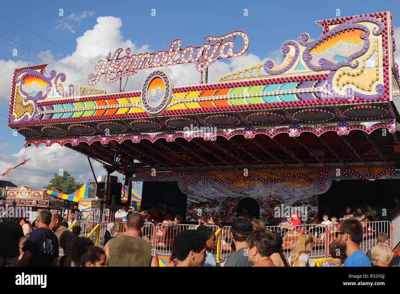 Himalaya carnival ride. Crowd of people in the foreground. Canfield