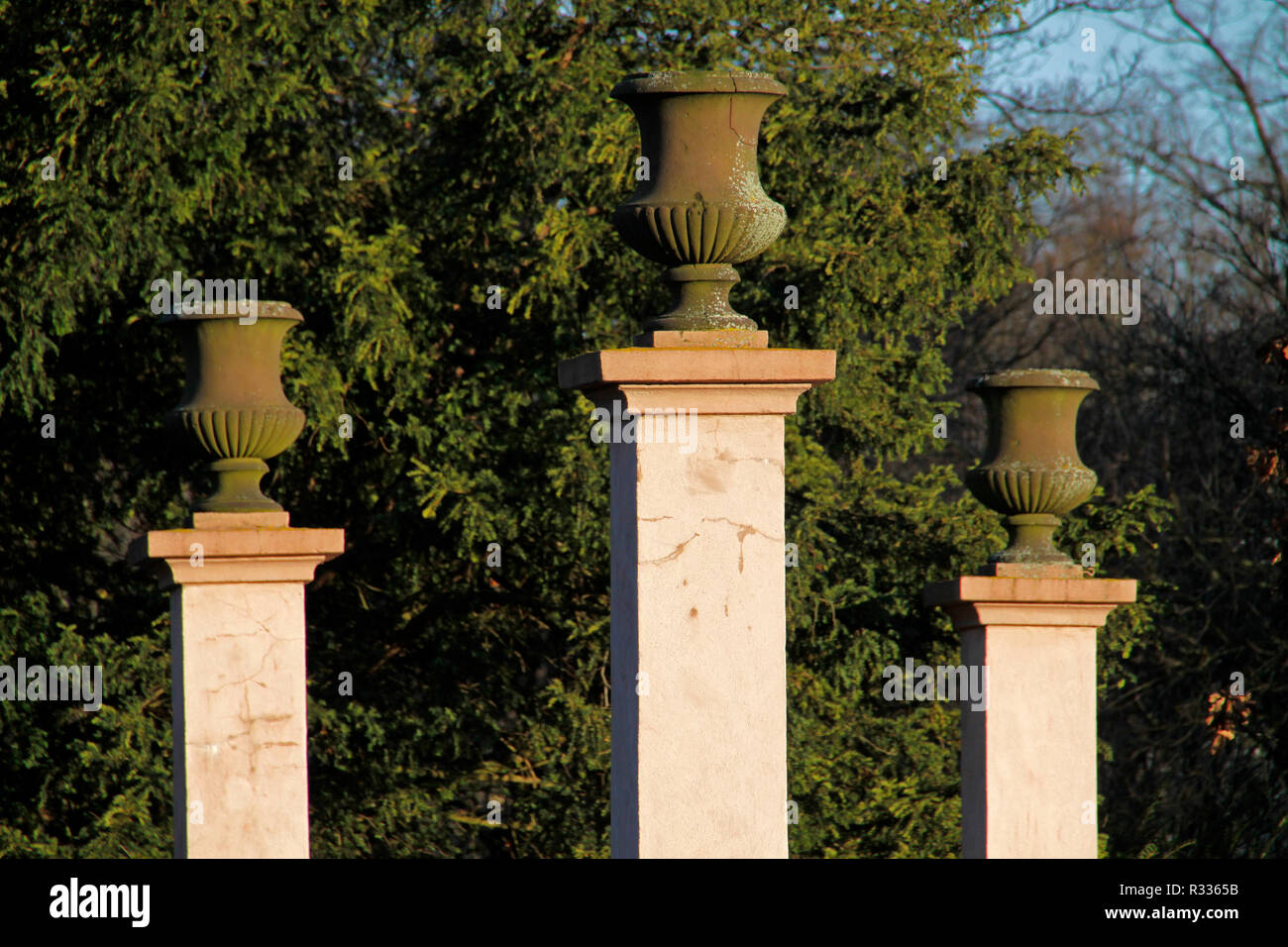 column with vase in a park Stock Photo
