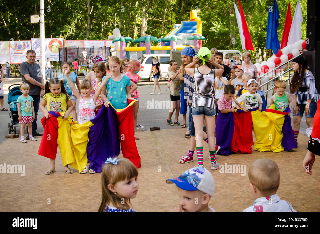 Komsomolsk-on-Amur, Russia - August 1, 2016. Public open Railroader's day. two children teams ready to flee in sewn sacks at a pirate party Stock Photo