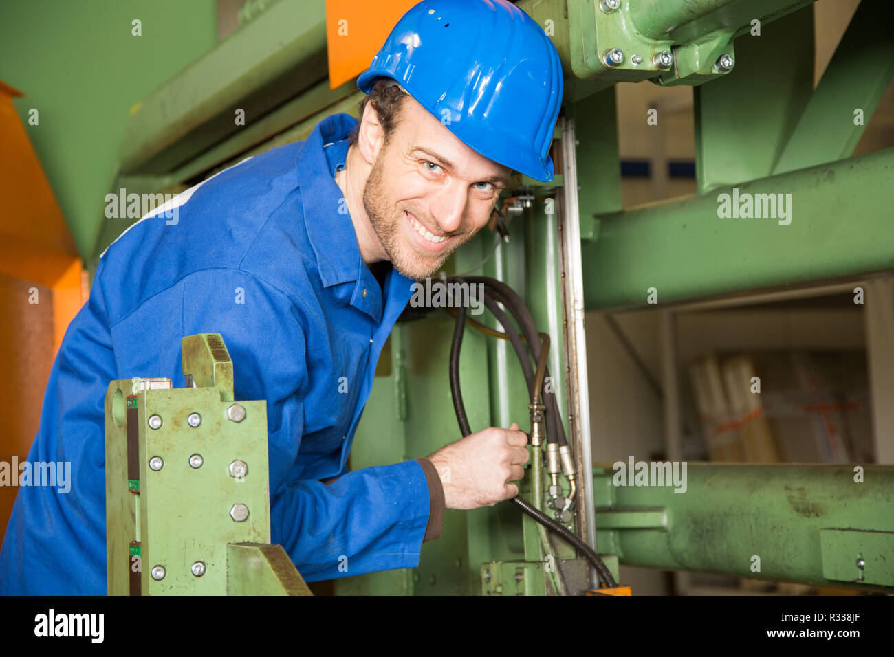 construction worker uses a machine Stock Photo