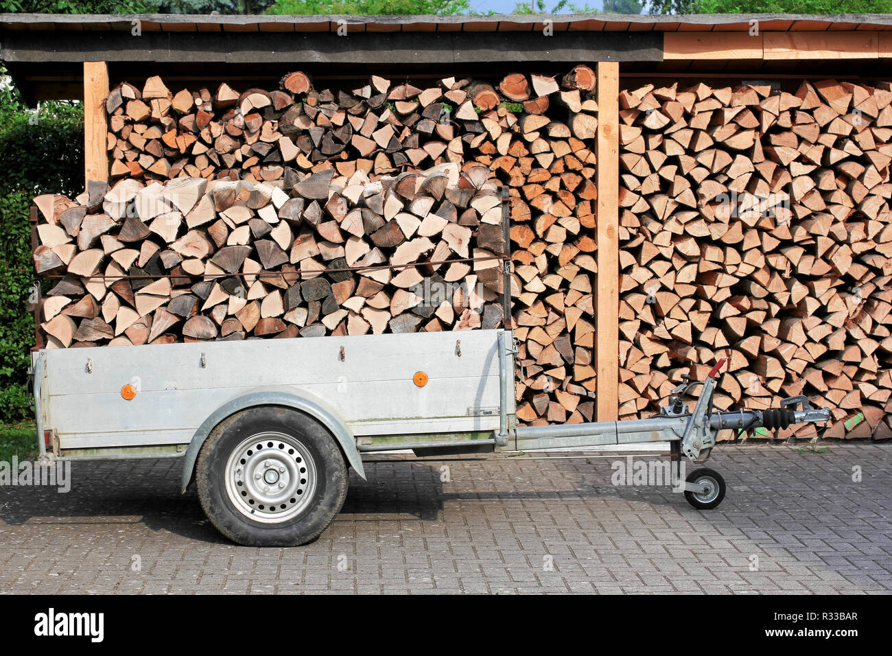 trailer and shed with firewood,firewood Stock Photo