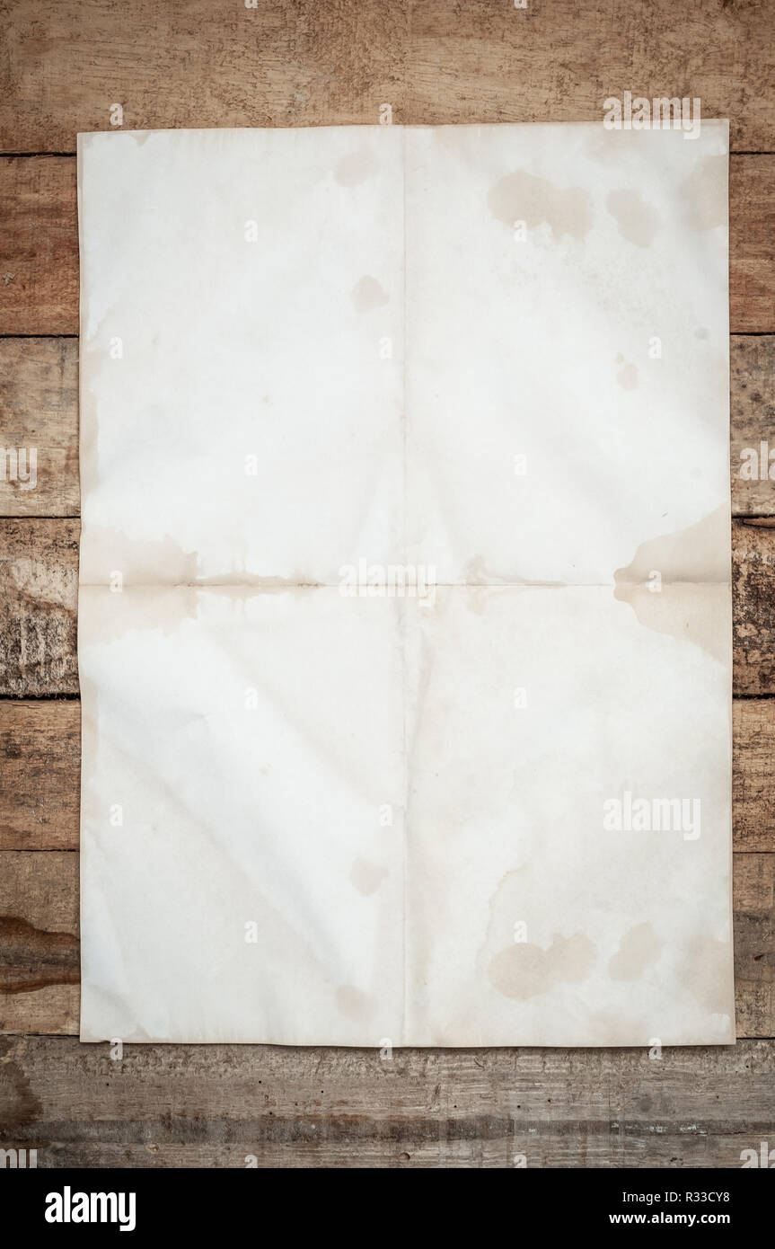 Vintage Crumpled paper texture on wooden table Stock Photo