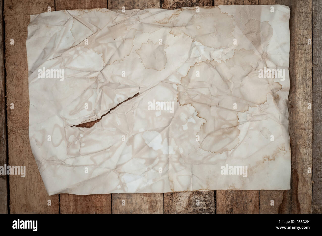 Empty Vintage Crumpled paper letter texture on wooden table surface Stock Photo