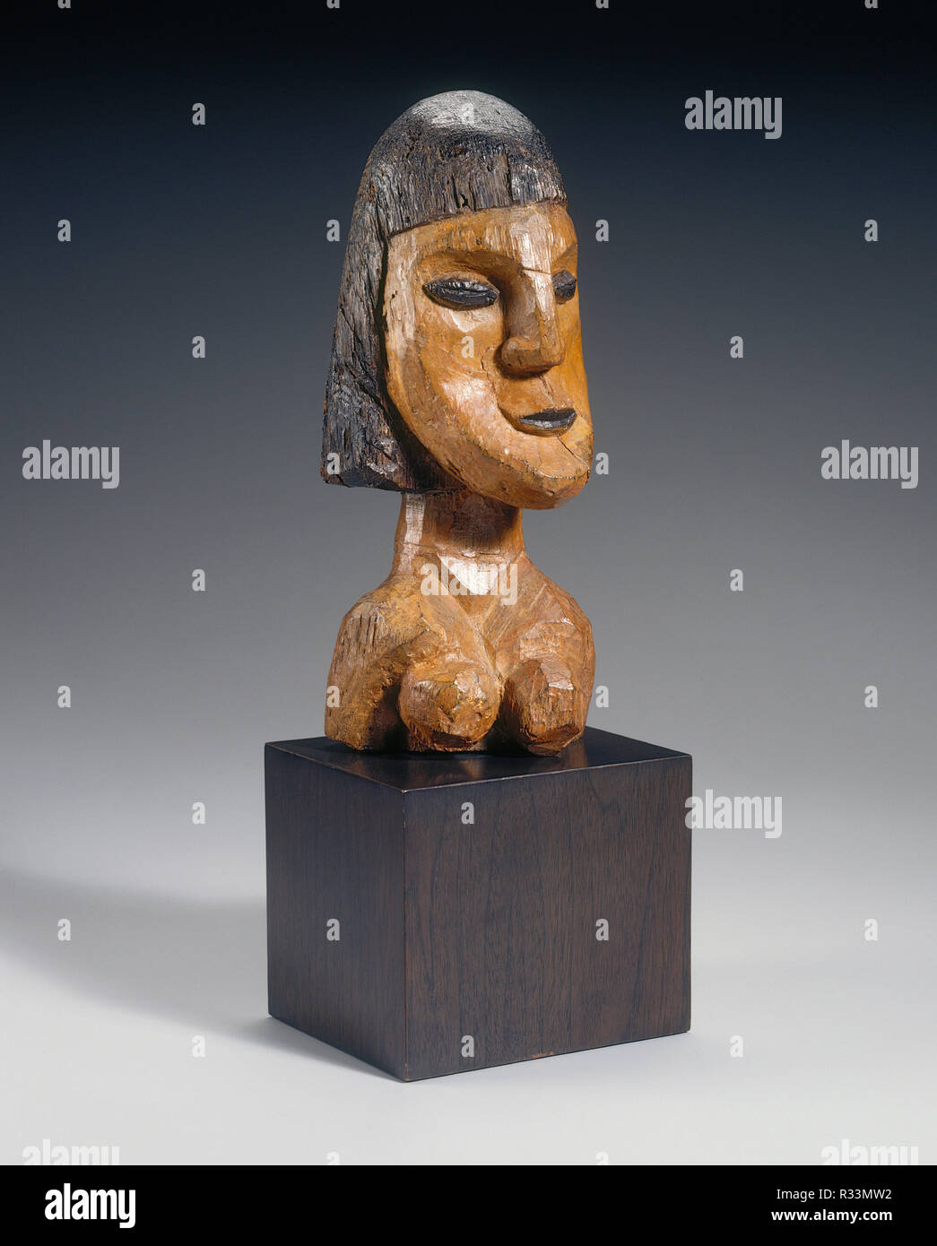 Head of a Woman. Dated: 1913. Dimensions: overall with base: 50.8 x 32.7 x 31.27 cm (20 x 12 7/8 x 12 5/16 in.)  overall without base: 35.56 x 14.92 x 16.03 cm (14 x 5 7/8 x 6 5/16 in.)  base: 15.2 x 17.8 x 15.2 cm (6 x 7 x 6 in.). Medium: carved and painted oak. Museum: National Gallery of Art, Washington DC. Author: ERNST LUDWIG KIRCHNER. Stock Photo