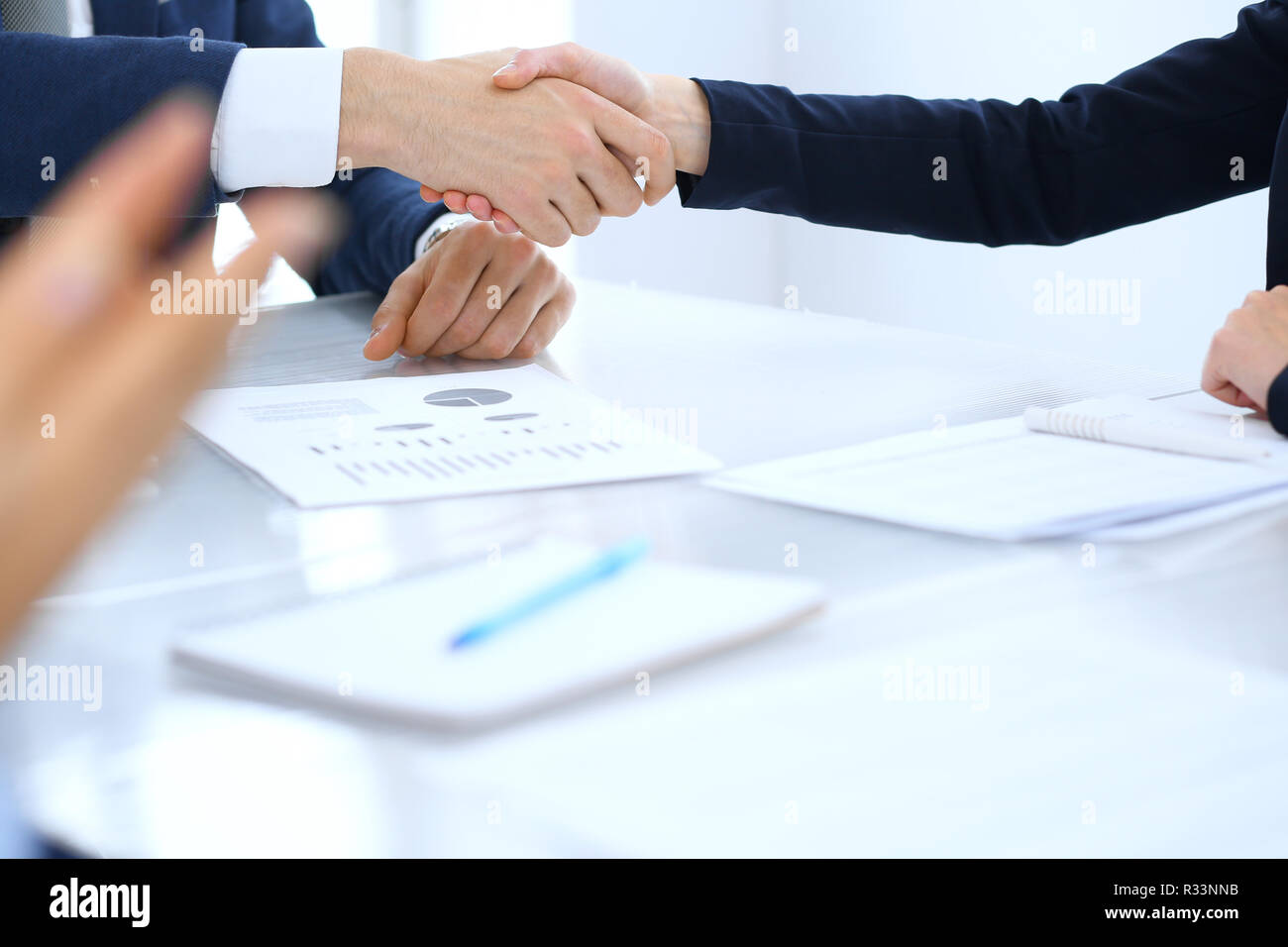 Group of business people or lawyers shaking hands finishing up a meeting , close-up. Success at negotiation and handshake concepts Stock Photo