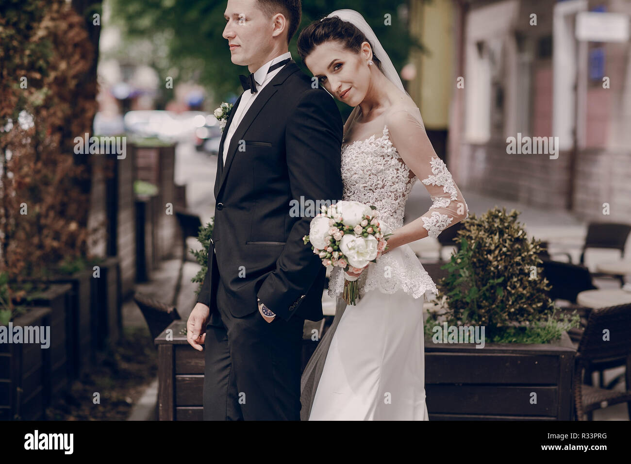The bride and groom walking along sunny streets Stock Photo - Alamy