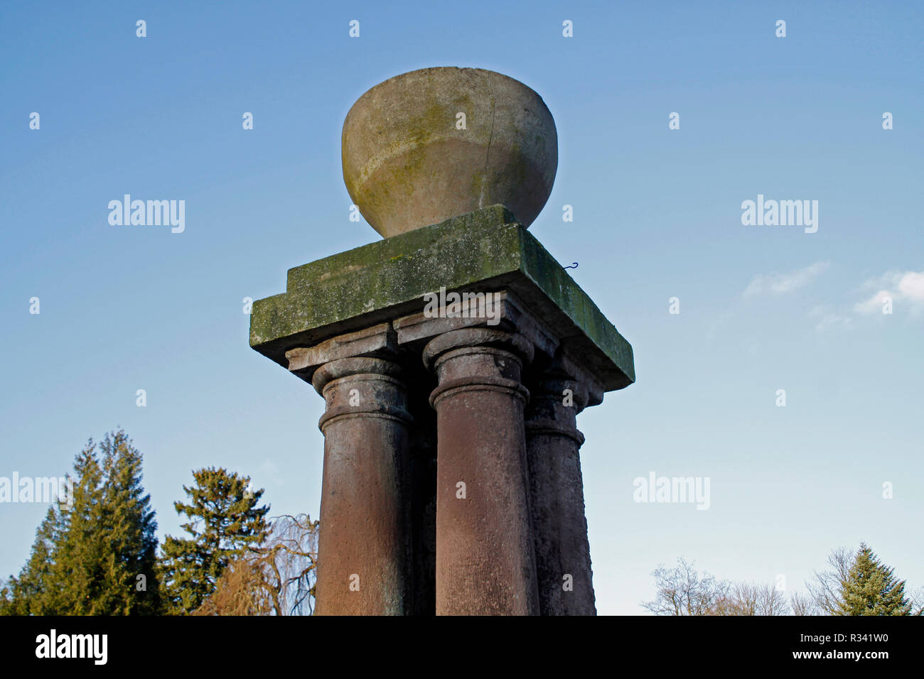 pillar with vase in a park Stock Photo