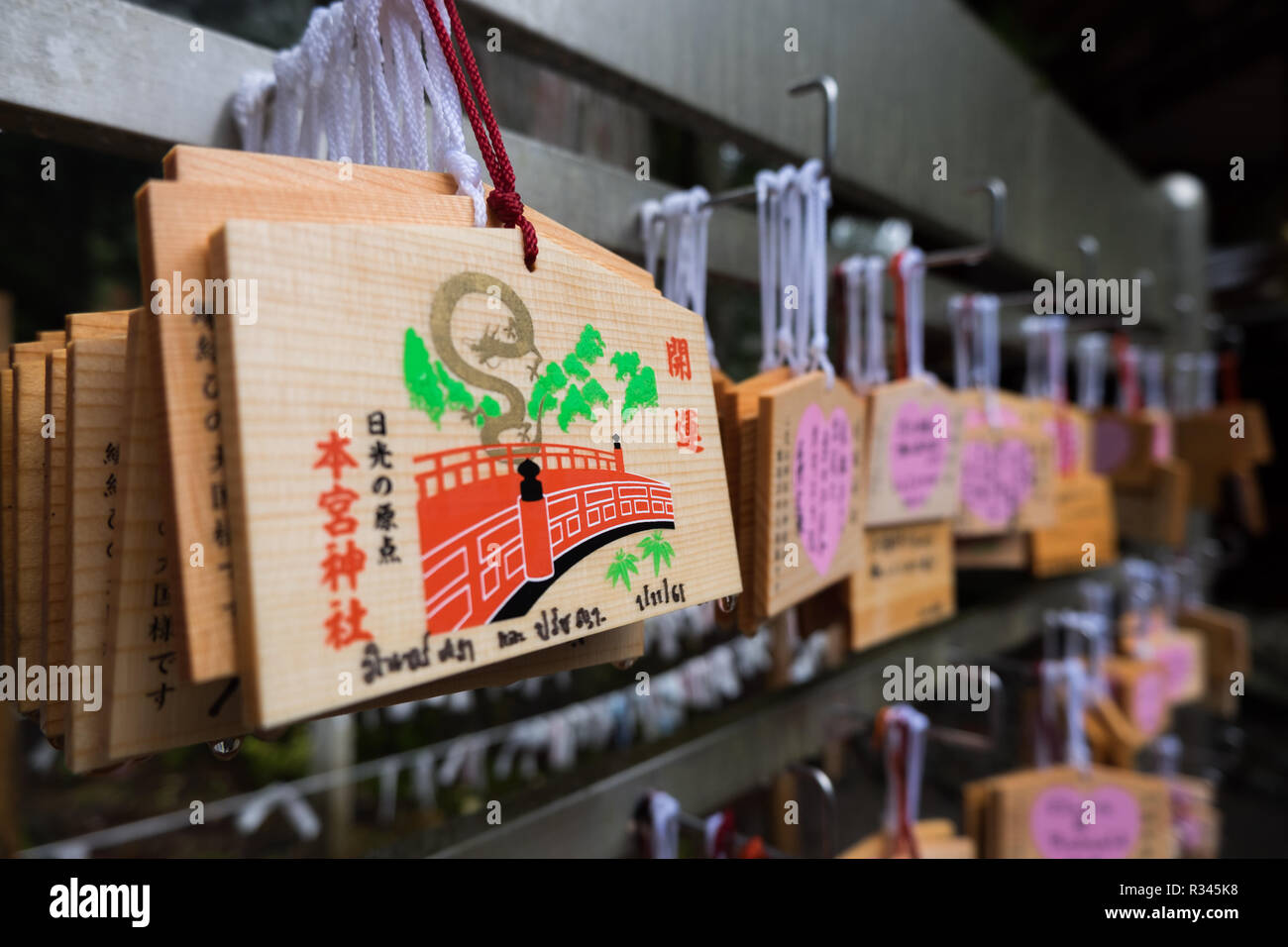 Wooden Ema wooden prayer plaques at Nikko Futarasan jinja in Nikko, Japan. You write your wishes on the plaque and then hang it. Stock Photo