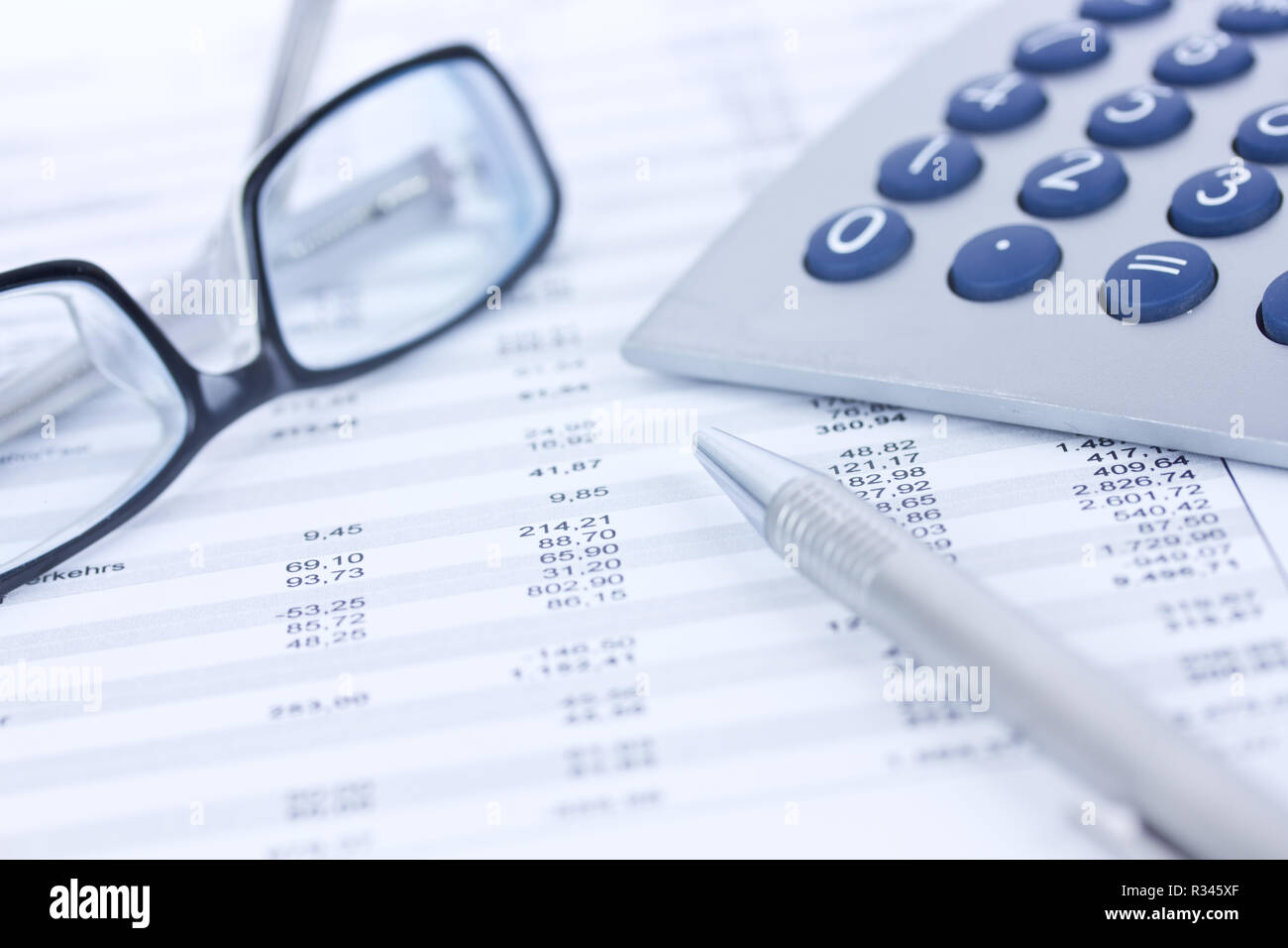 calculators and columns of figures Stock Photo
