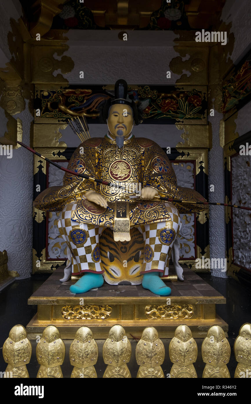 Japanese Samurai gold leaf statue with bow and arrow at Toshogu in Nikko, Japan. Stock Photo