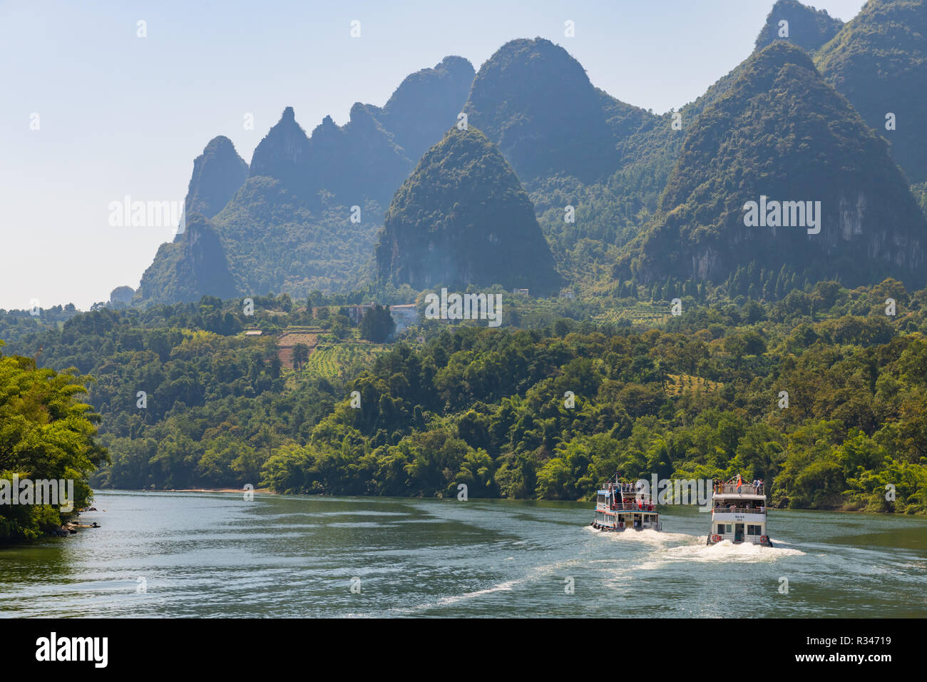Cruise boats on the Lijiang (Li) river- China Stock Photo