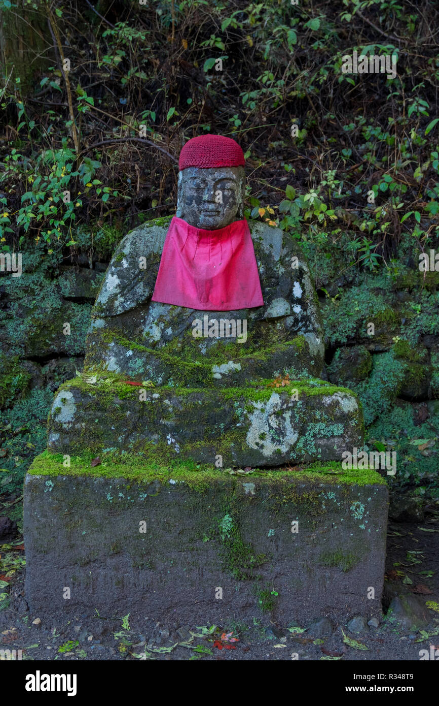 Sacred Jizo statues line a path along the banks of the Daiya river