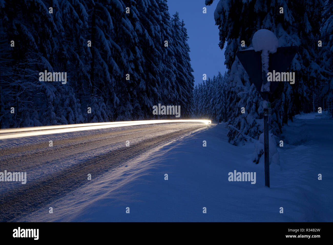 traffic in ice and snow at night Stock Photo