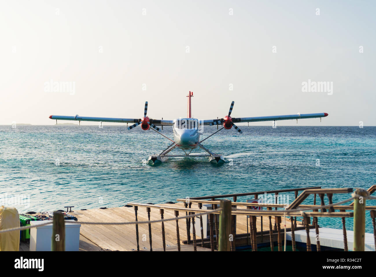 Airplane flying on sea ocean background, at maldives. Stock Photo