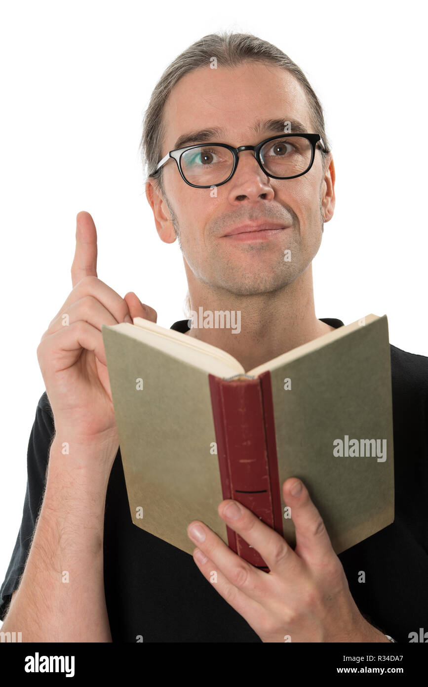 man with book raises his index finger Stock Photo