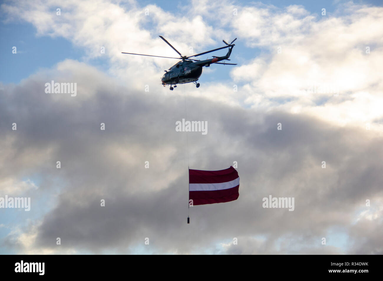 November 18, 2018. NATO helicopters and airplane with flag at military parade in Riga, Latvia. Celebration of 100 year off free independent Latvia. Stock Photo