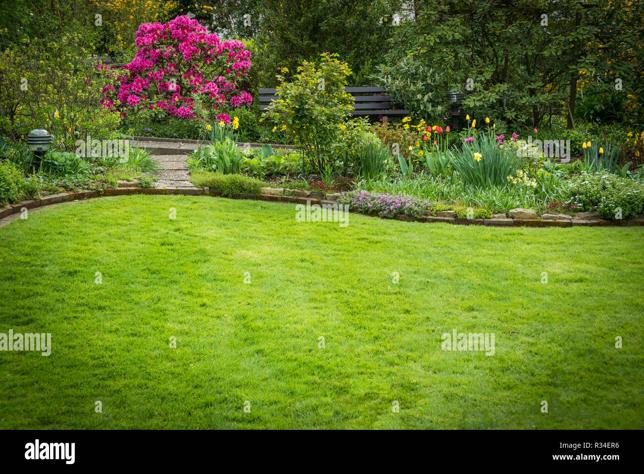 beautifully landscaped garden with lawn Stock Photo