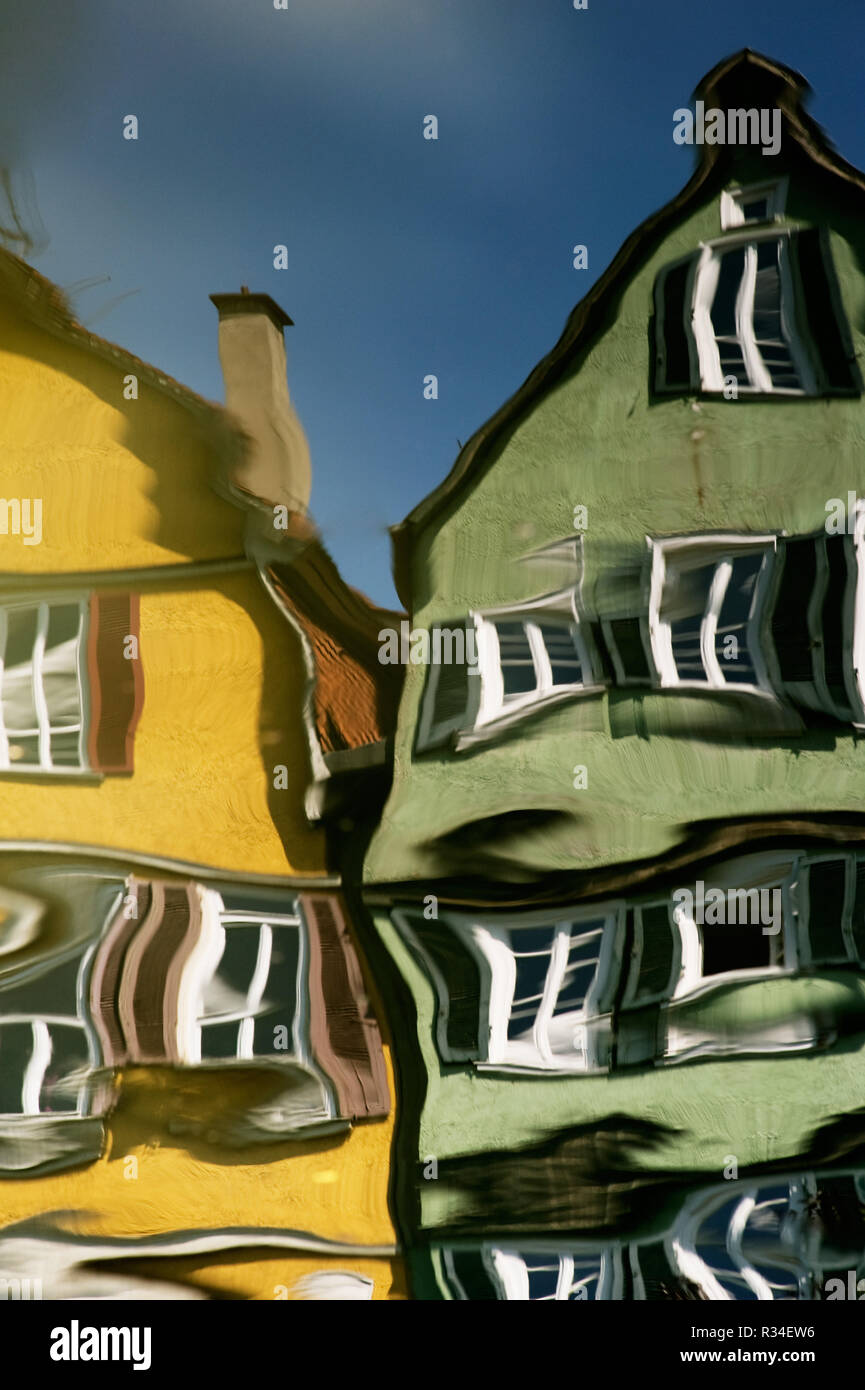 houses mirrored in the river Stock Photo