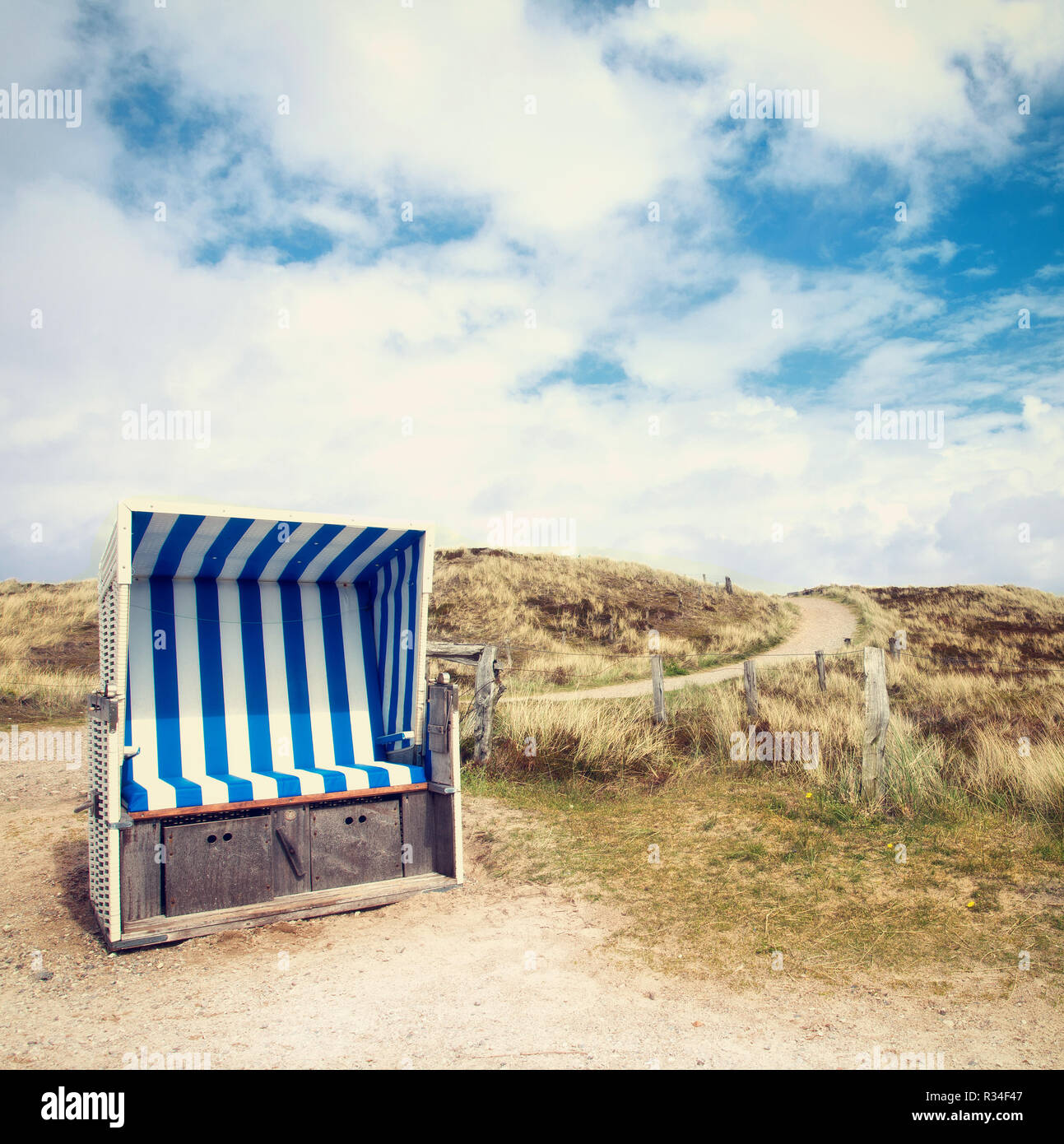 empty beach chair in the dunes Stock Photo