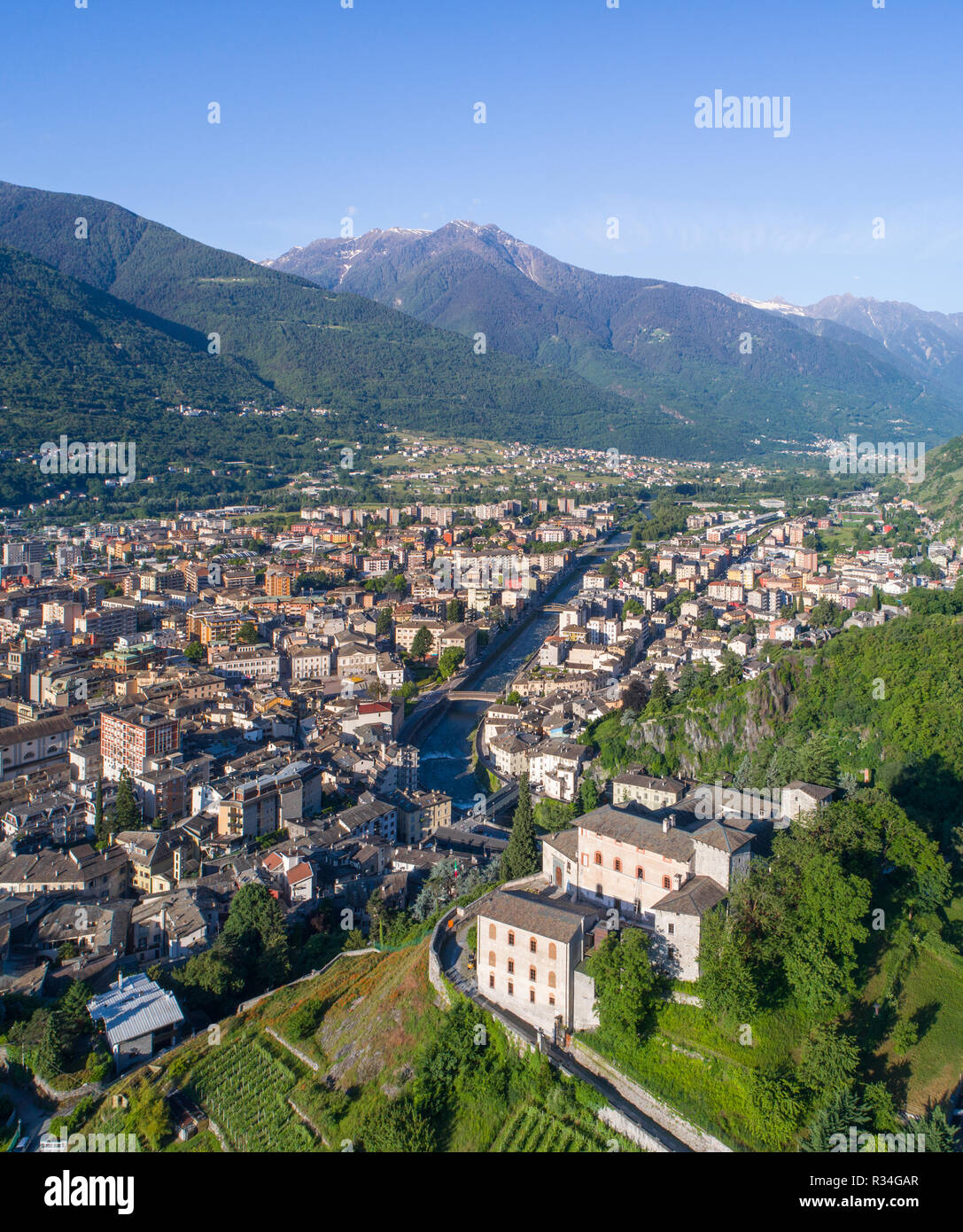 Valtellina, panoramic view of city of Sondrio and Masegra Castle. Aerial photo Stock Photo