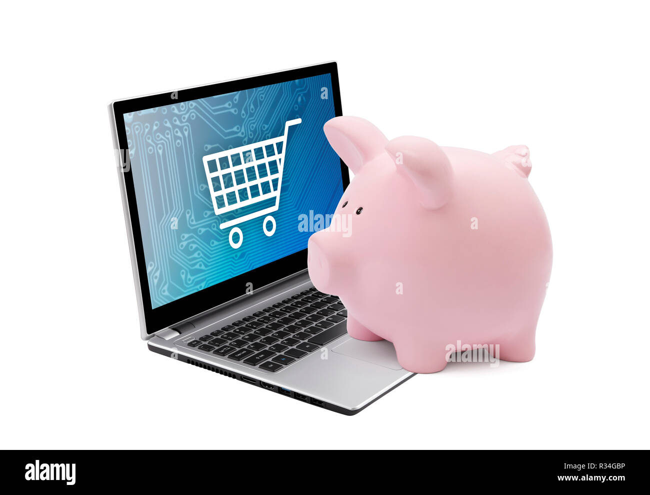 Piggy bank and laptop with shopping cart graphic. Saving concept Stock Photo