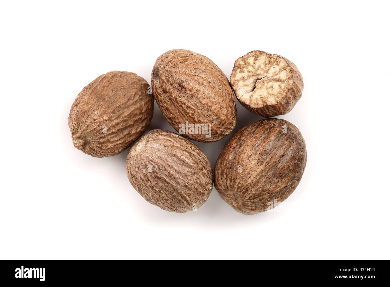 Nutmeg isolated on white background. Top view Stock Photo