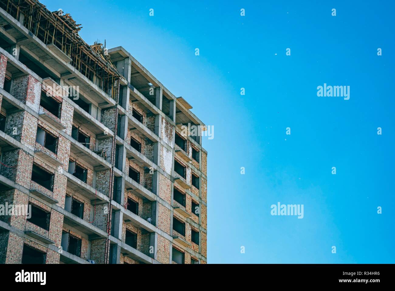 unfinished building with blue sky in the background in a sunny day. Developing of Construction industry Stock Photo