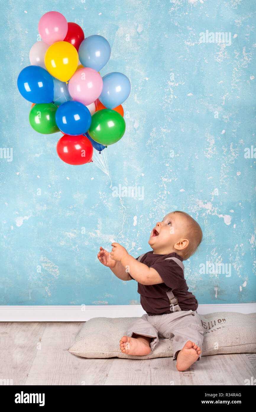 little boy playing with balloons Stock Photo