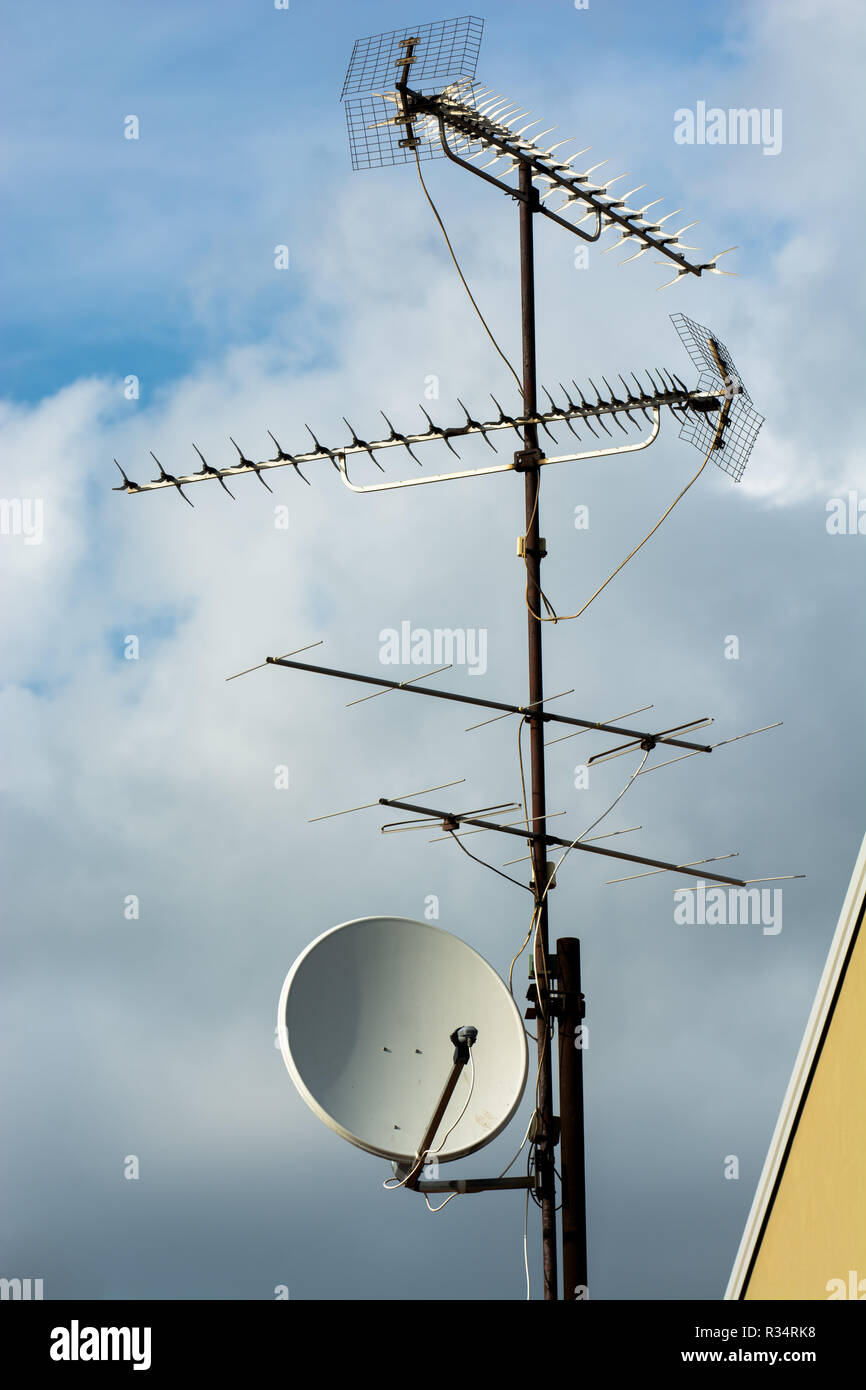complex antenna on house roof Stock Photo Alamy