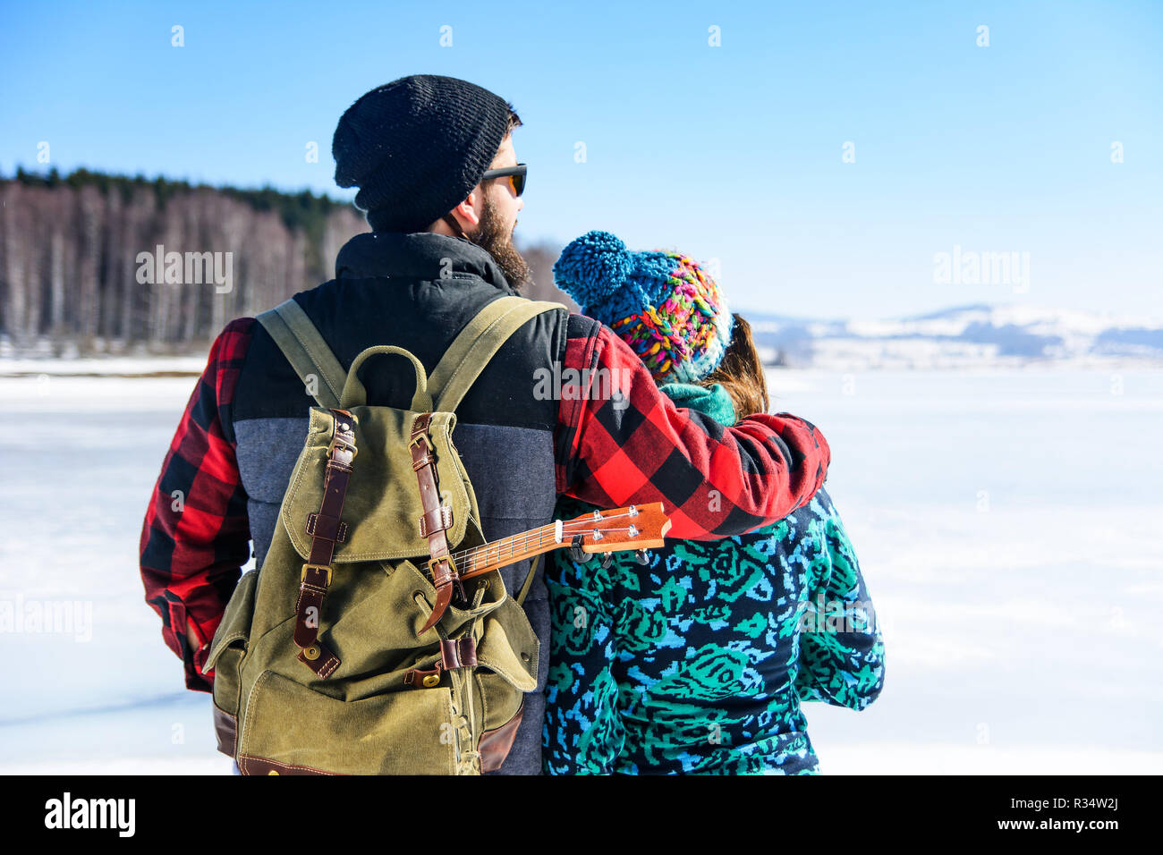 Couple enjoying the day on a frozen lake surface Stock Photo