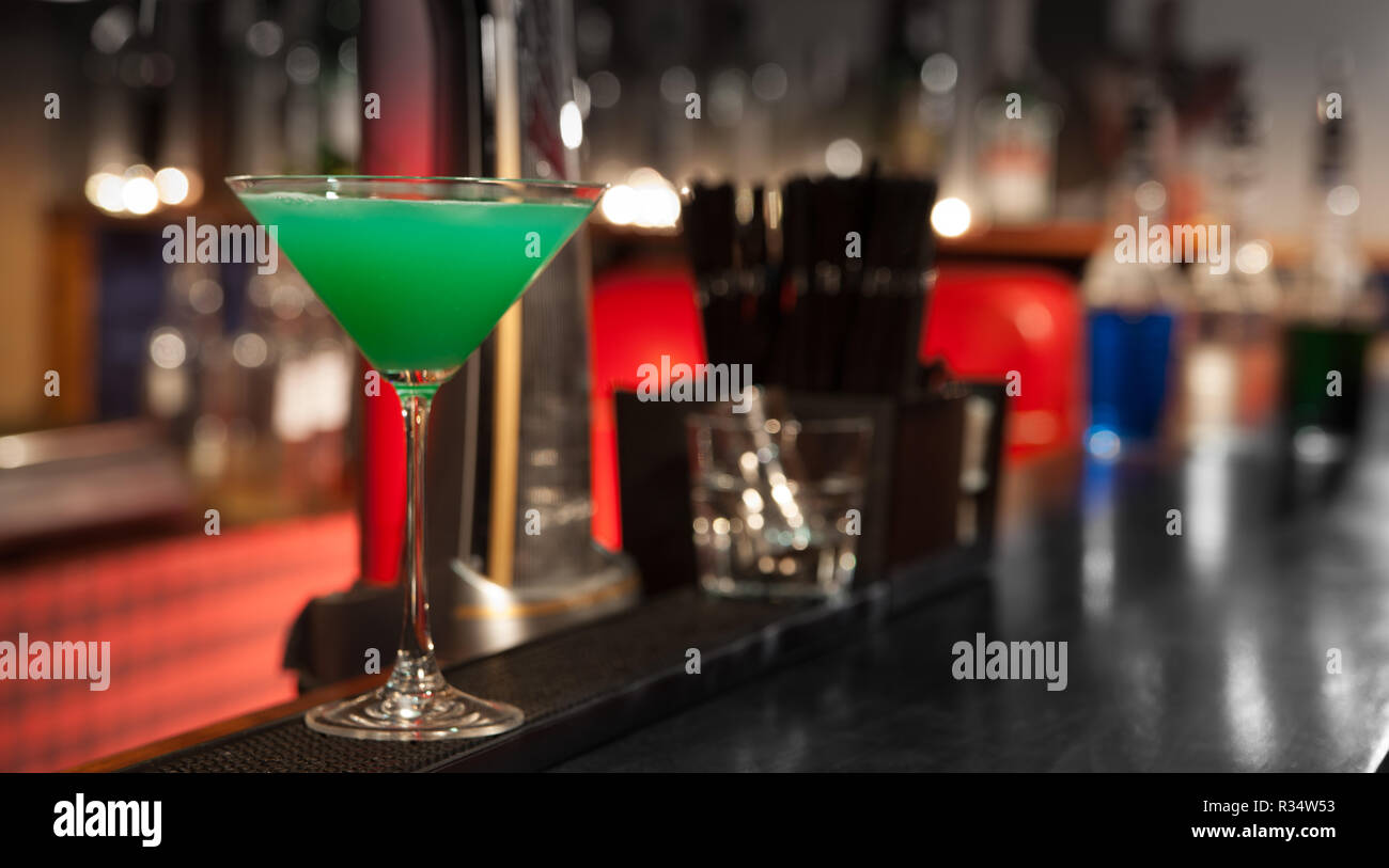 Green cocktail in a glass on the bar Stock Photo