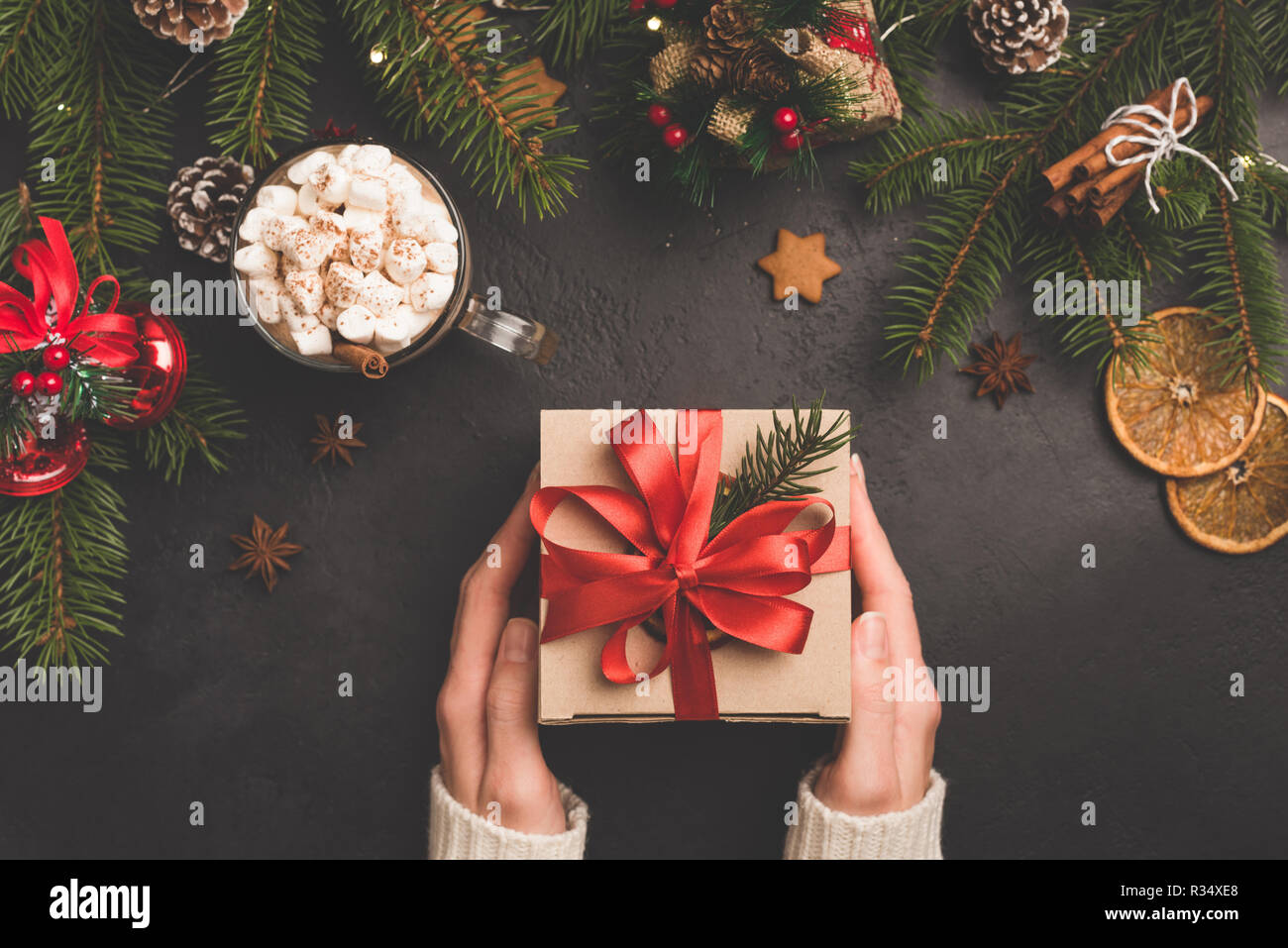 Wrapped Christmas presents with decoration in snow. Flat lay of gift boxes  in green and brown kraft wrapping paper Stock Photo - Alamy