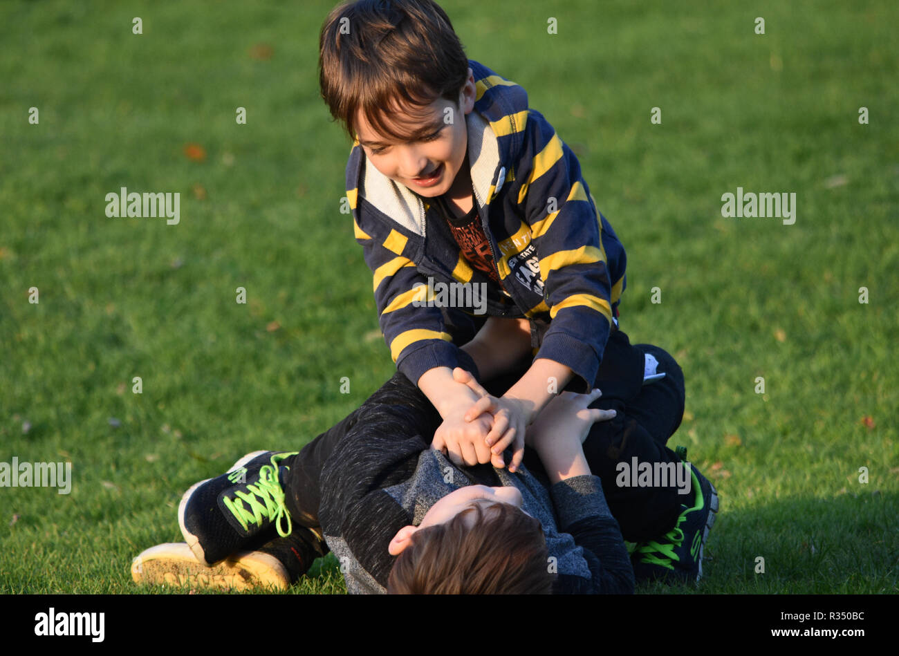 Pre teen young boys fighting Stock Photo